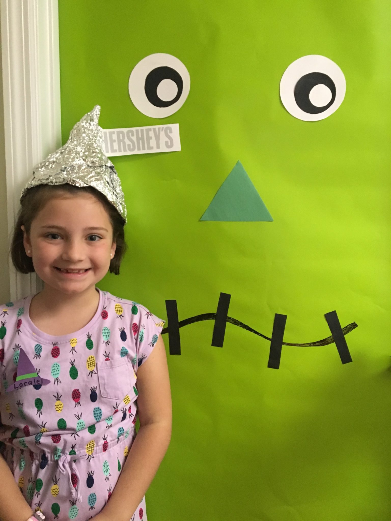 She makes that Hershey Kiss hat look even sweeter!